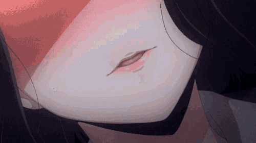 a close up of a person 's mouth with a red spot on it