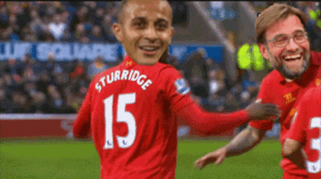 a man in a red jersey with the number 15 on it