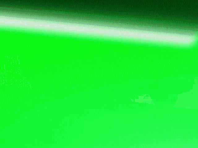 a close up of a person 's hand wearing a white glove on a green screen .