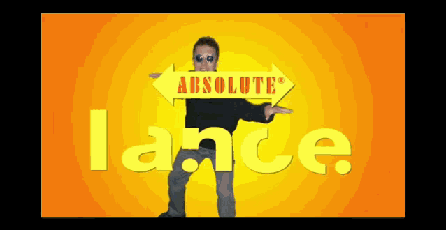 a man in sunglasses stands in front of a sign that says absolute lance