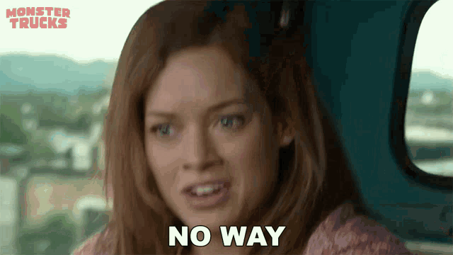 a woman sitting in a car with the words no way written on her face