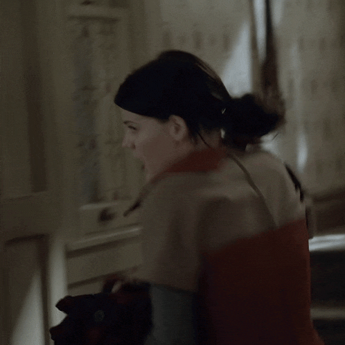 a blurry picture of a woman 's face with a ponytail