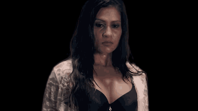 a woman in a black bra and white robe