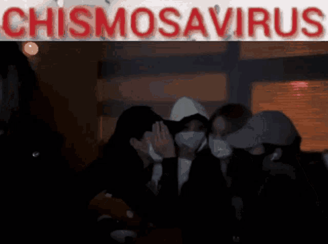 a group of people wearing face masks are standing in front of a sign that says chismosaurus
