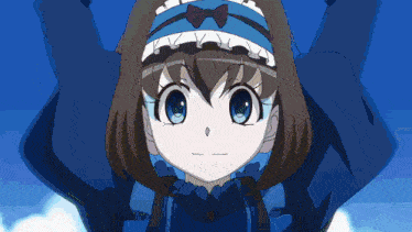 a girl in a blue dress with a bow on her head