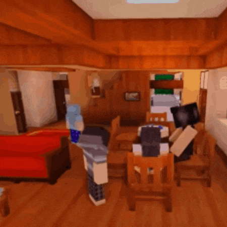 a living room with a red couch and chairs