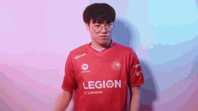 a man is wearing a red legion by lenovo jersey