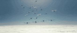 a flock of planes are flying in the sky