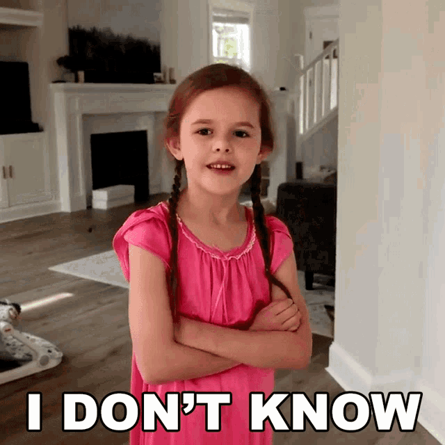 a little girl in a pink dress with her arms crossed says i don t know