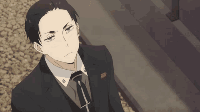 a man in a suit and tie with a pocket square that says ' sd ' on it