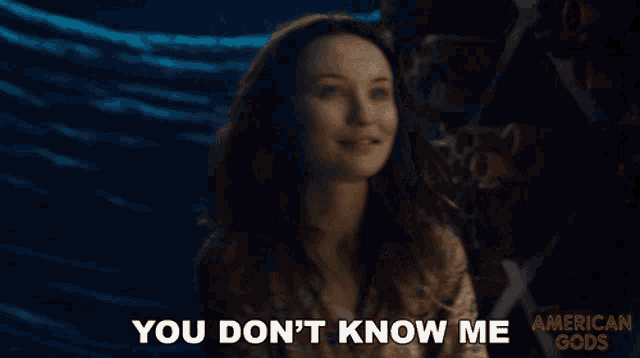 a woman says " you don 't know me " in front of a blue cloth
