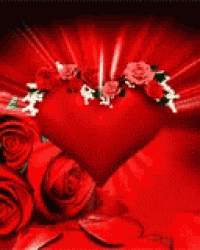 a red heart surrounded by red roses and petals