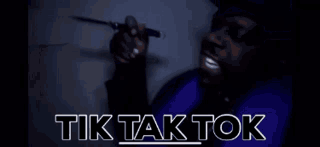 a blurred image with the words tik tak tok in white letters