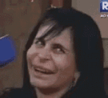 a close up of a woman 's face with the letter r on the bottom right