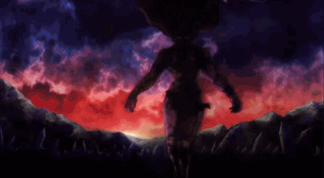 a silhouette of a person standing in front of a sunset sky