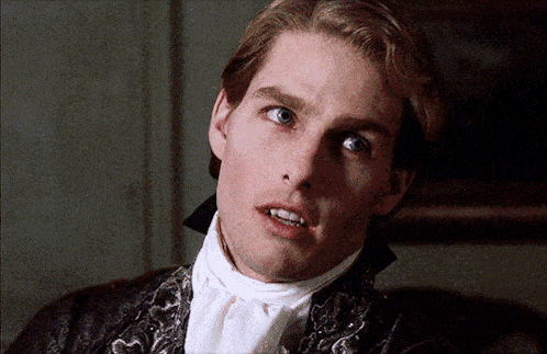 a close up of a man 's face with a white tie