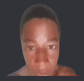 a close up of a person 's face with a black background