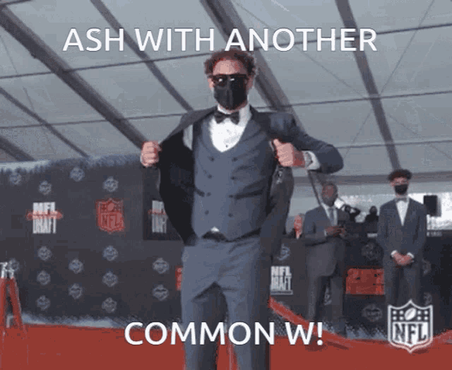 a man in a suit is standing on a red carpet with a caption that says ash with another common w.