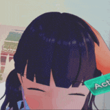 a close up of a person 's head with a green item that says ' a ' on it
