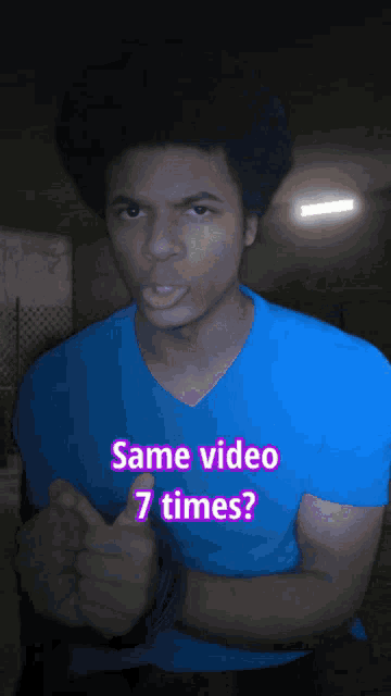 a man in a blue shirt is giving a thumbs up with the words same video 7 times