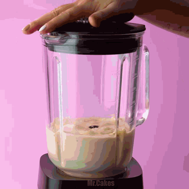 a blender with the word mr.cakes written on it