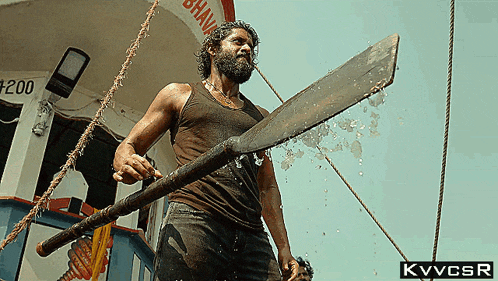 a man with a beard is holding a large sword in front of a sign that says bhava