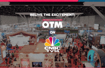 an advertisement for cnbc tv18 shows a large convention hall