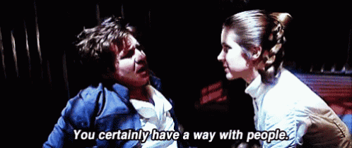 a man and a woman are standing next to each other and the woman is saying `` you certainly have a way with people .