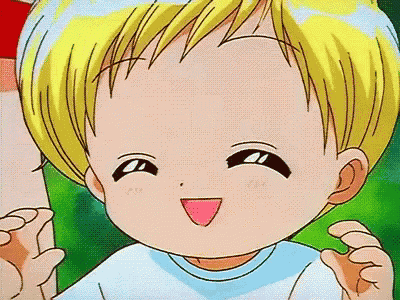 a close up of a child 's face with a pink tongue out