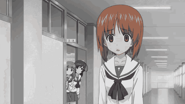 a girl in a school uniform is standing in front of a door with the number 2a on it