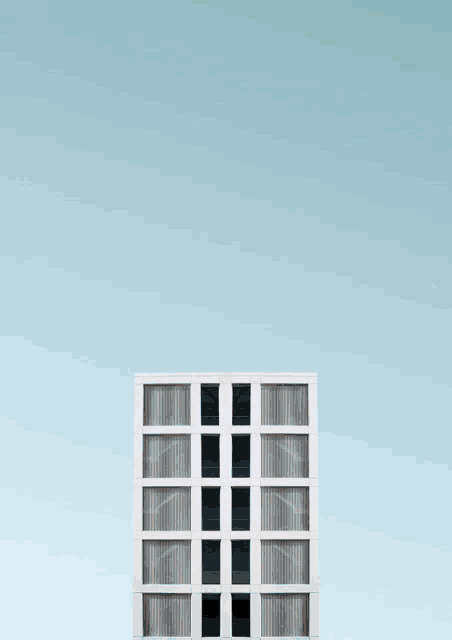 a cartoon boy is standing on top of a building with hearts above him