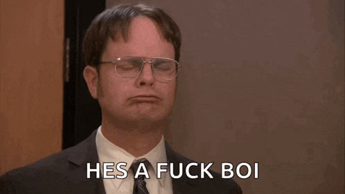 a man in a suit and tie with his arms outstretched says hes a fuck boi
