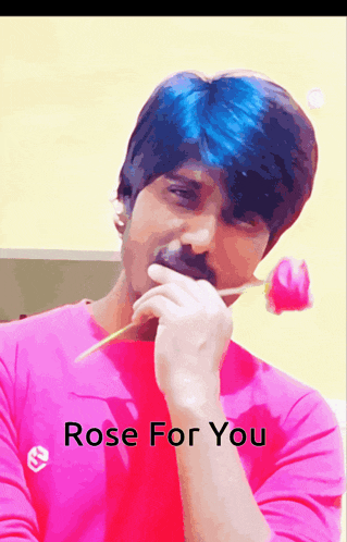 a man in a pink shirt is holding a rose in his mouth and the words rose for you are below him