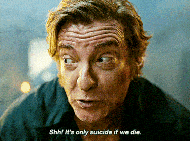 a close up of a man 's face with the words shhh it 's only suicide if we die below him