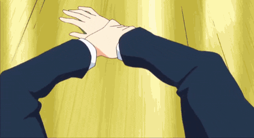 a man in a suit is reaching out towards another man 's hand