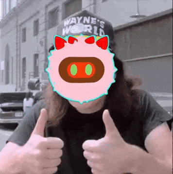 a man wearing a hat that says wayne 's world gives a thumbs up