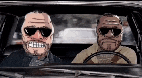 two men are sitting in a car wearing sunglasses and masks .
