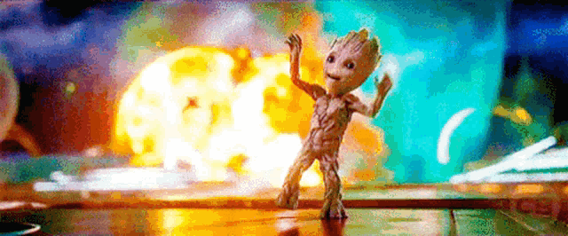 groot is dancing in front of a giant explosion in guardians of the galaxy 2 .