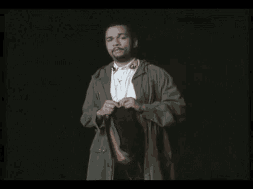 a man in a green jacket is standing in front of a black background with the words votre sourire est une nourriture on it