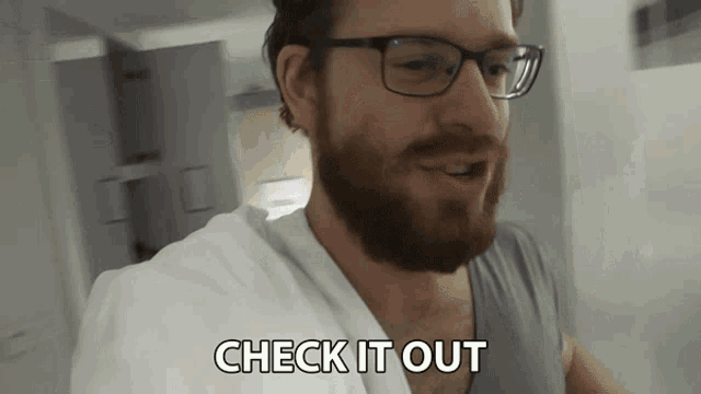 a man with glasses says check it out