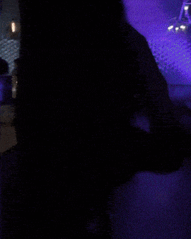 a blurry photo of a person eating a sandwich