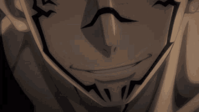 a close up of a man 's face with a smile