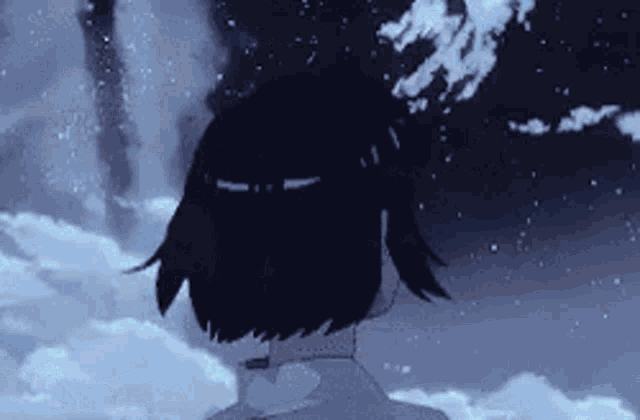 a girl with short black hair is standing in the snow looking at the sky .