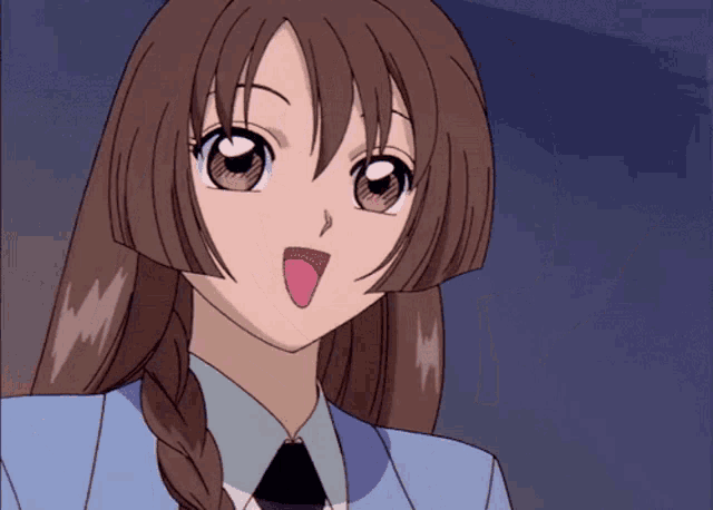 a close up of a girl with brown hair and a blue jacket