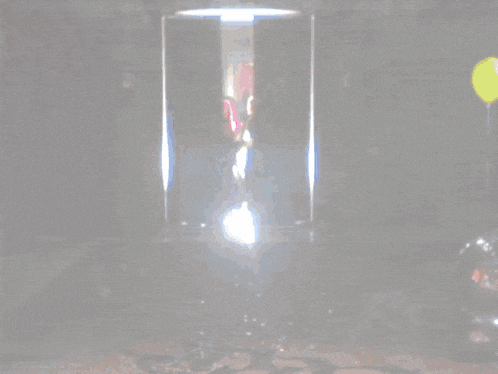 a disco ball is being smashed by a person on the floor
