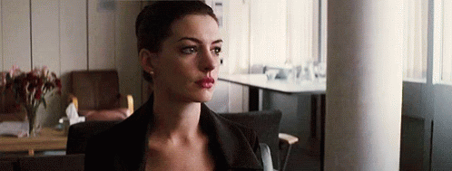 Como Cuando Empieza Con Sus Chingaderas GIF - Anne Hathaway Eyesrolling Stare GIFs