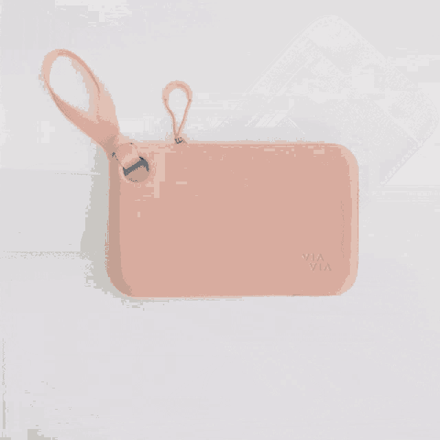 three wallets are stacked on top of each other on the sidewalk
