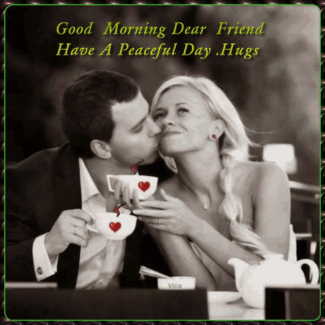 a man kissing a woman on the cheek while holding two cups of coffee