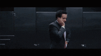 a man in a suit and tie is talking on a cell phone and the words i 'm jacked are above him