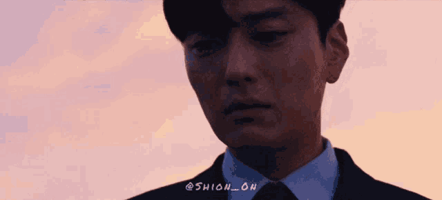 a close up of a man 's face with shion_on written on the bottom right